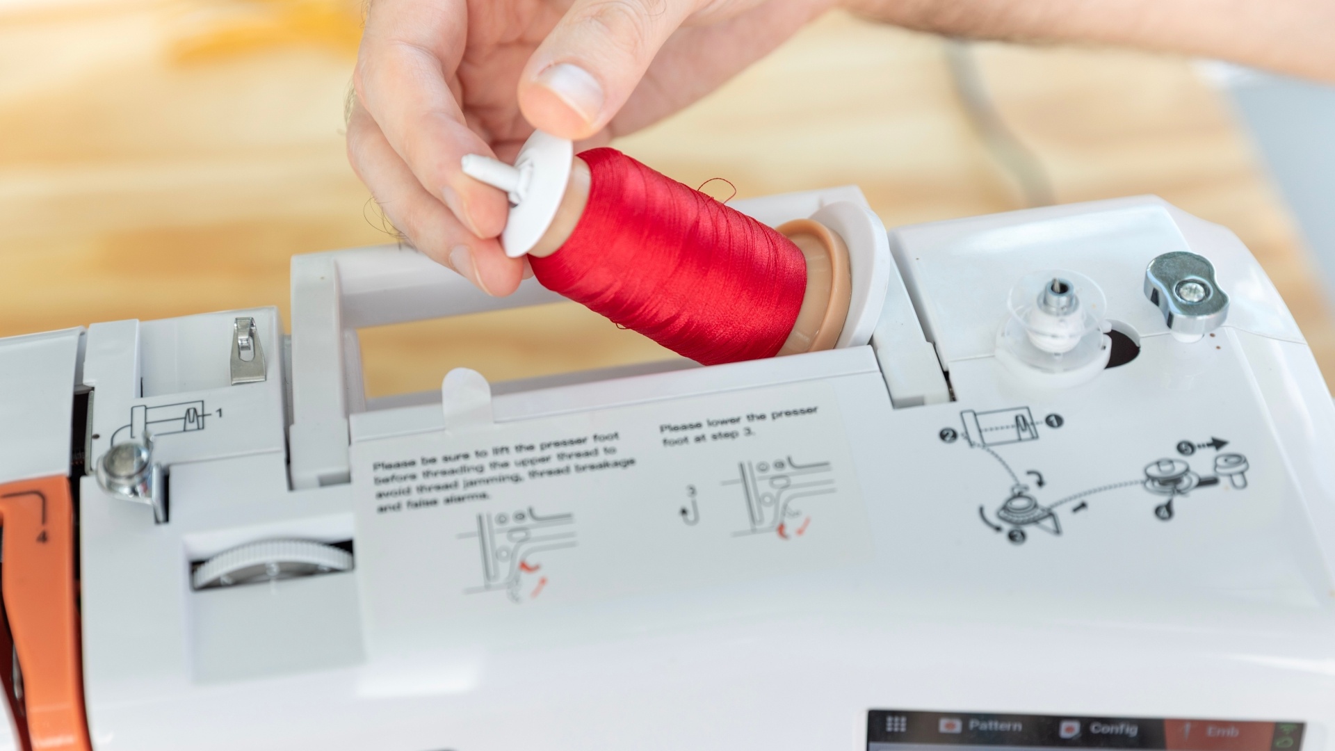 You can use the spool holder on top of the embroidery machine